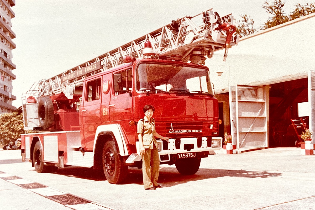 Mdm Beatrice Ho in front of the Magirus Turn-table Ladder 30m at Alexandra Fire Station