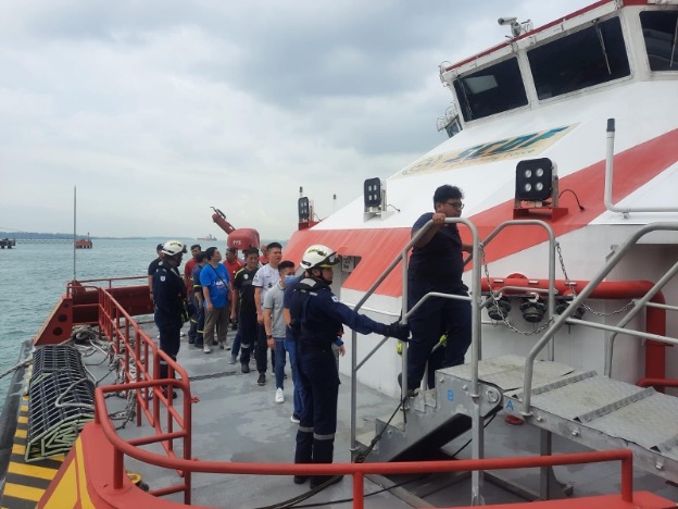 Evacuees boarding the Red Manta during the sea evacuation segment of the exercise
