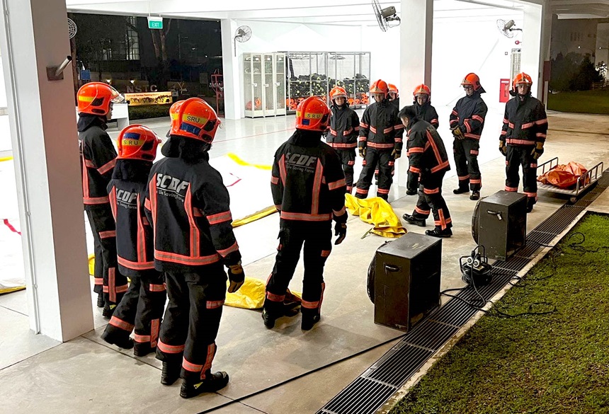 Volunteer Firefighters watching a training demonstration donned in their bunker gears