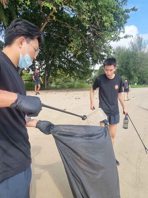 Personnel from SCDF 2nd Division cleaning up the beach at Changi Beach