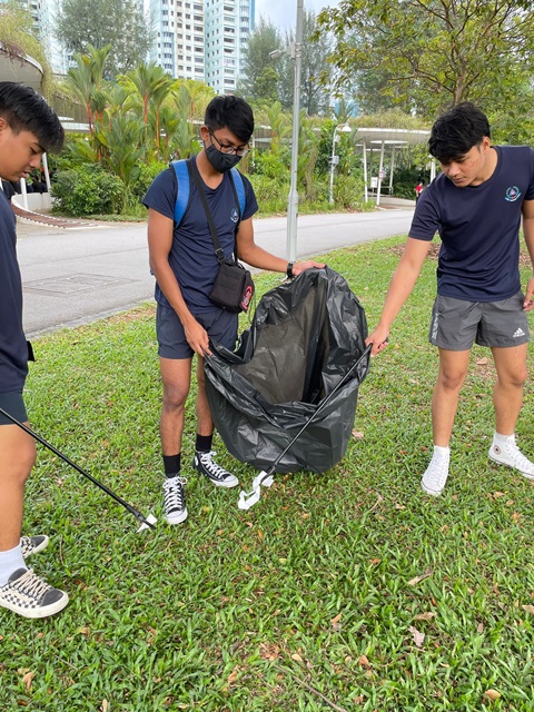 Personnel from SCDF 4th Division cleaning up the park at Jurong Lake Gardens