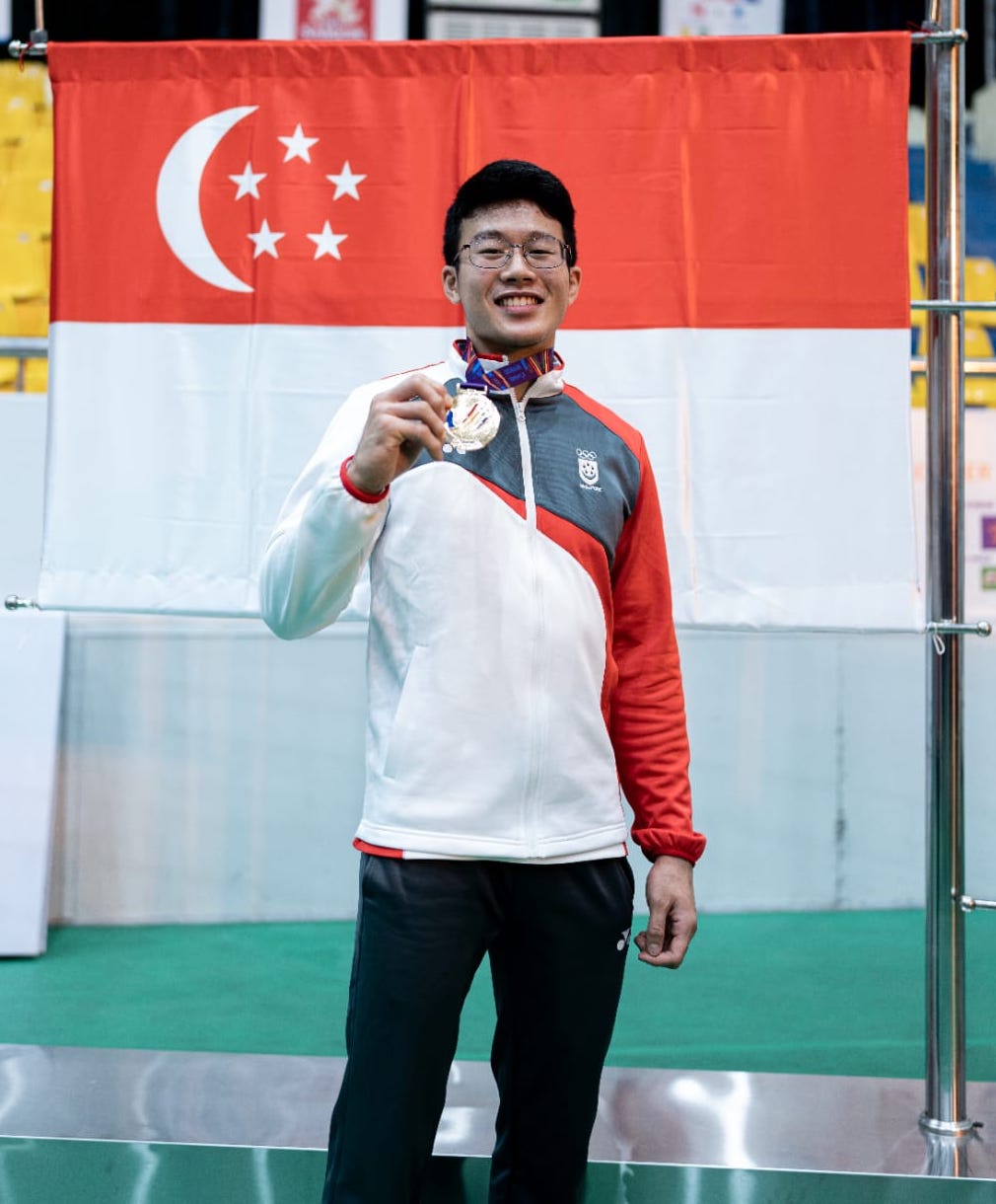 CPL (NSF) Noah proudly displays his gold medal at the SEA Games