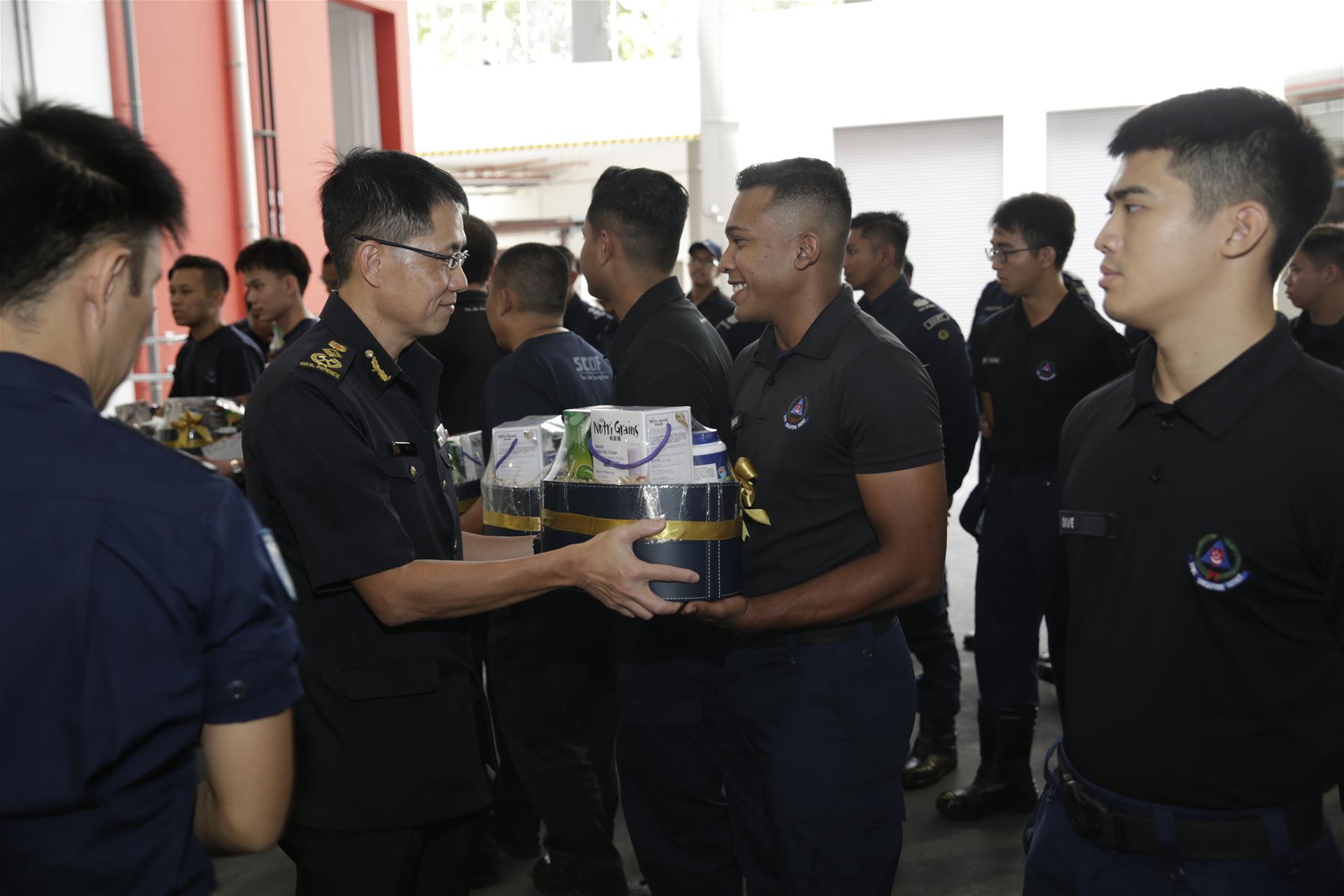 Commissioner Eric Yap showing appreciation to SCDF personnel at Kallang Fire Station