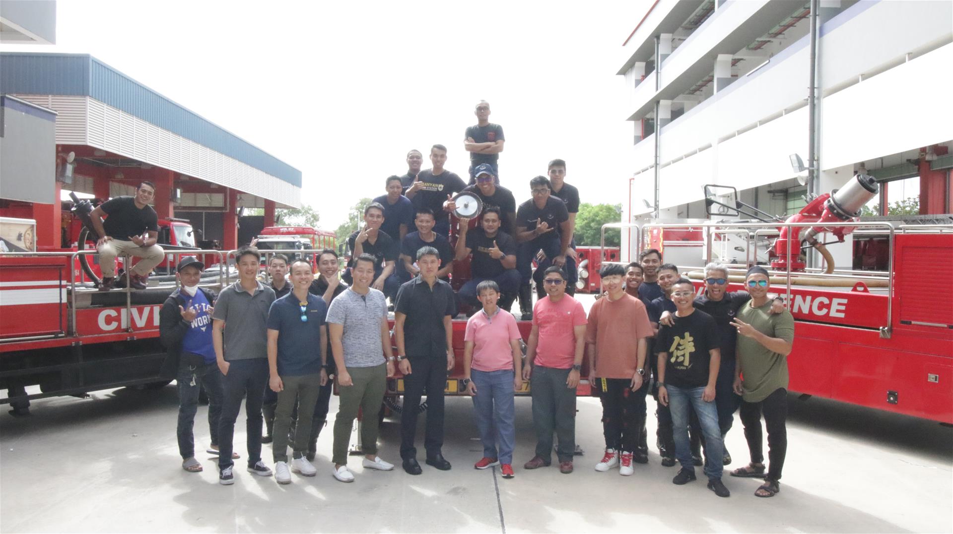 A group photograph of Commanders of Banyan Fire Station, both past and present, and its personnel.