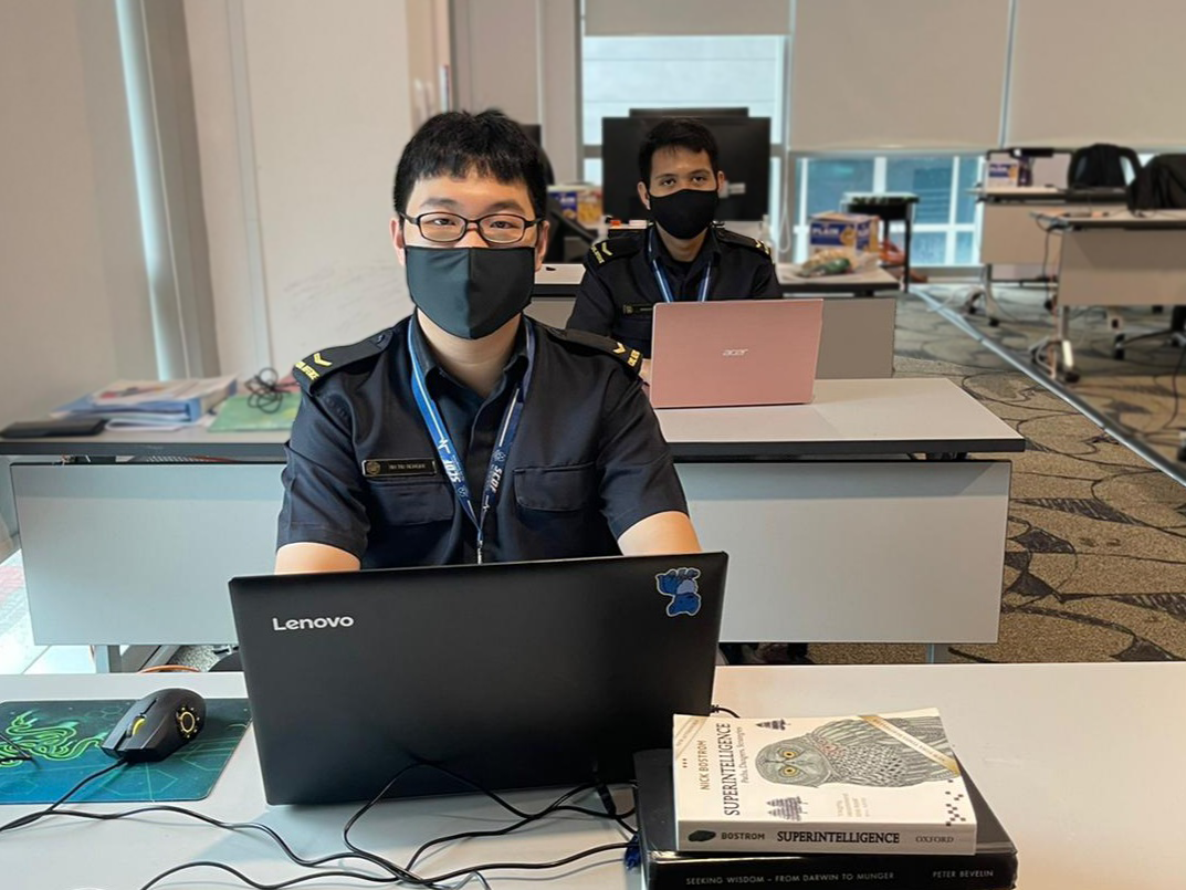 LCP(NSF) Ian Tay Rongde (left) and LCP(NSF) Mahadhir Bin Mohd Ismail (right) working on their assignments in office.