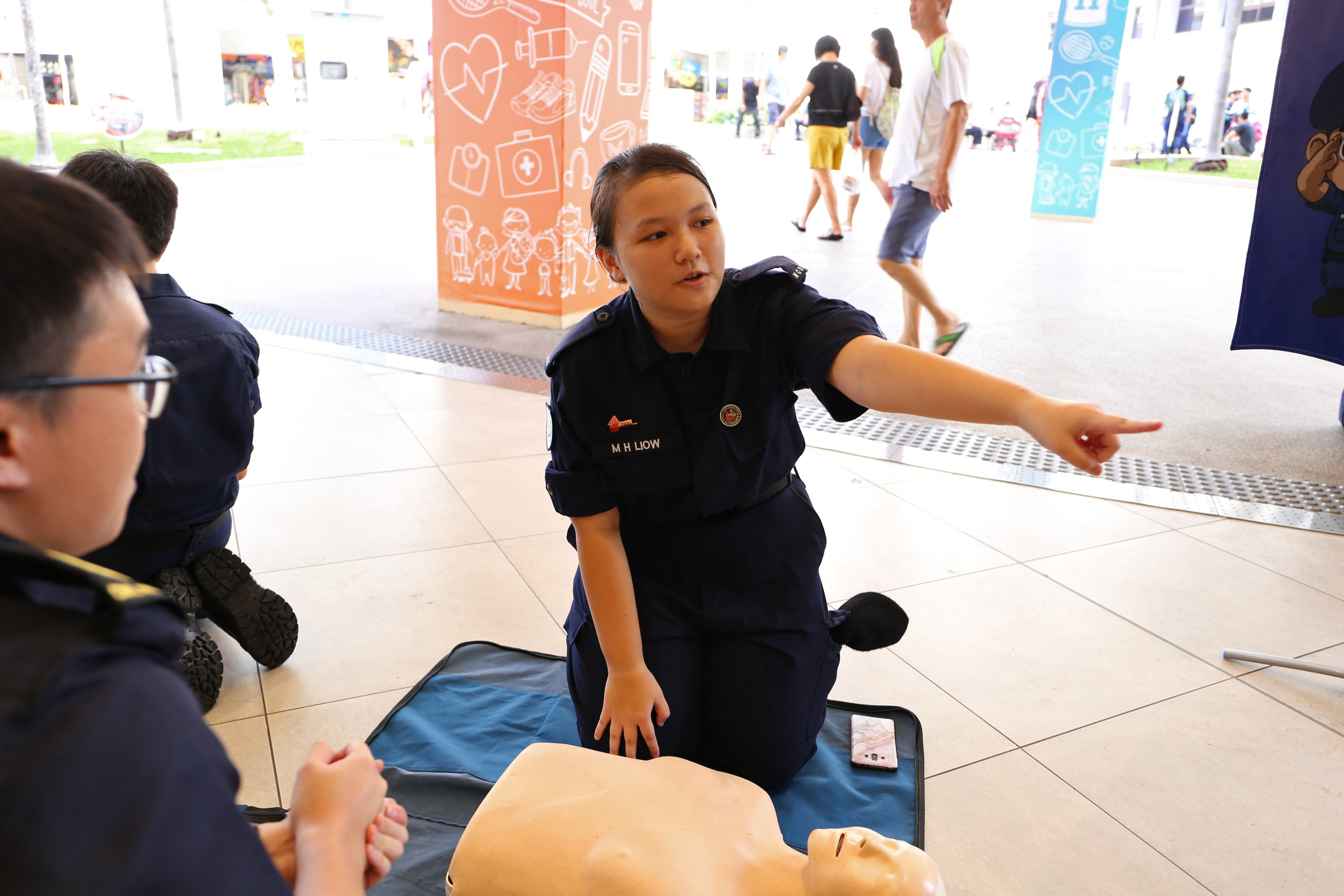 Min Hui learning and performing CPR in training