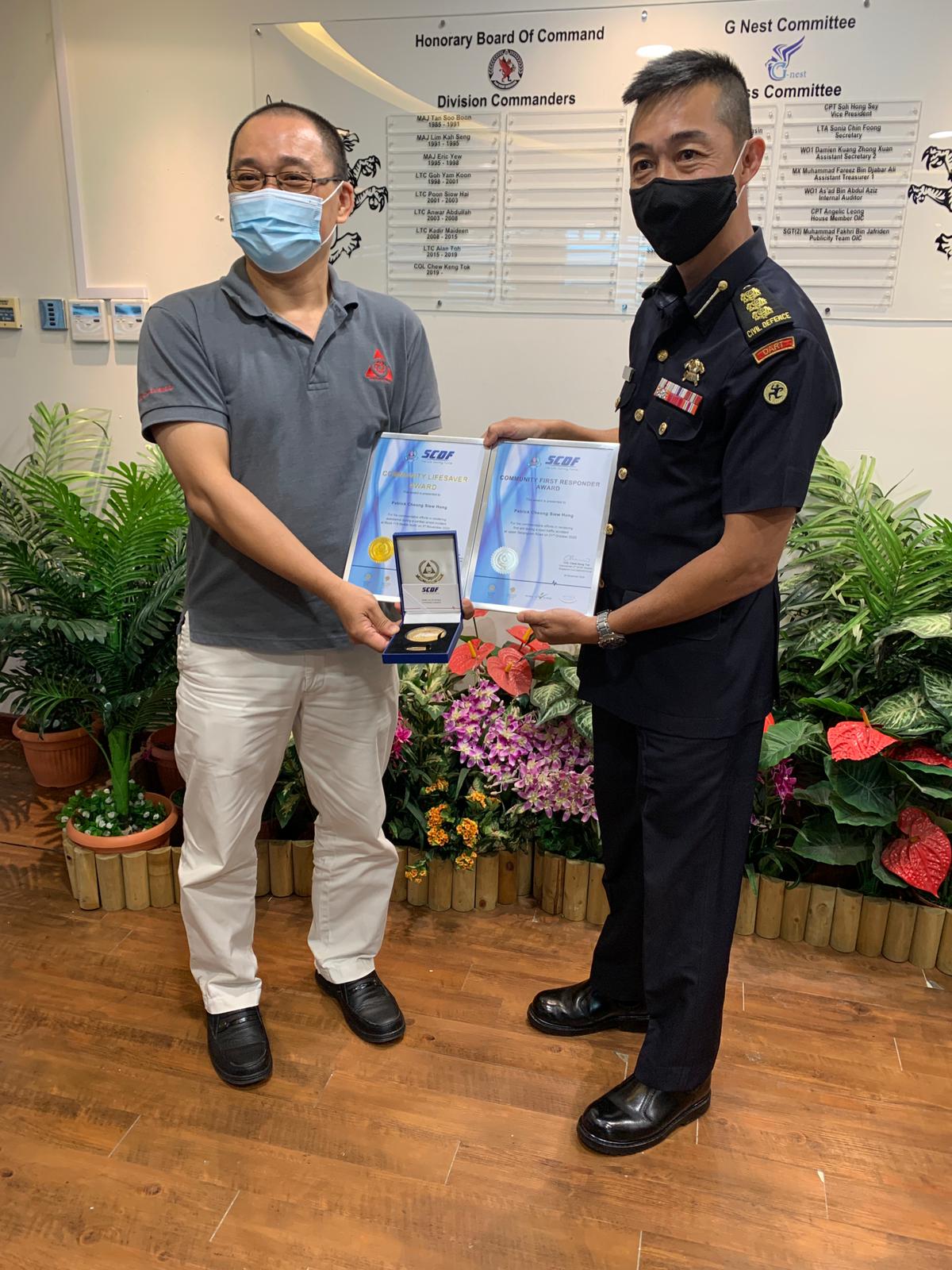Mr Patrick Cheong, Chairman, Bedok Community Emergency and Engagement Community receiving the Community First Responder Award and the Community Lifesavers’ Award