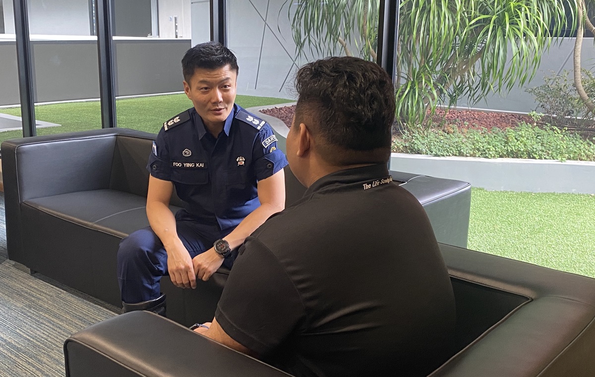 LTC Foo providing counselling to an SCDF personnel